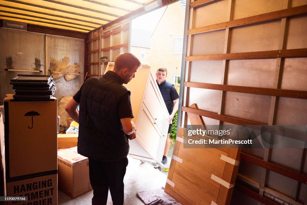 Loading furniture into removal truck