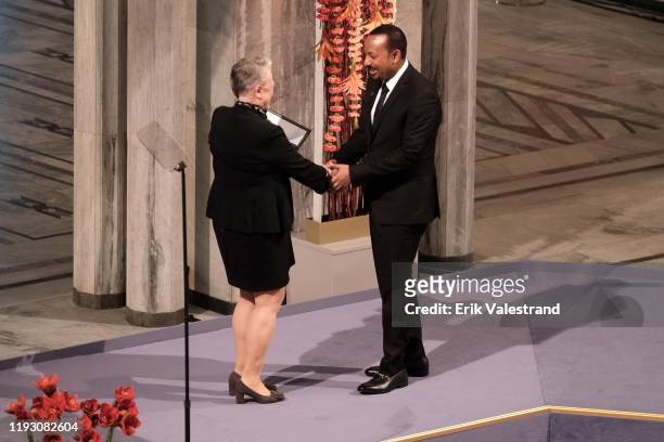 Ethiopia's Prime Minister and Nobel Peace Prize Laureate Abiy Ahmed Ali receives the Nobel Peace Prize award from Berit Reiss-Andersen Head Nobel...