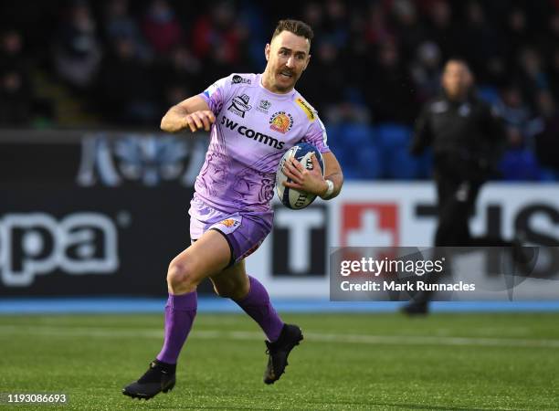 Nic White of Exeter Chiefs breaks free to score a try in the first half during the Heineken Champions Cup Round 5 match between Glasgow Warriors and...