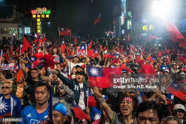Supporters react as Han Kuo-Yu, presidential candidate for Taiwan's main opposition Kuomintang party, joins his supporters after losing the Taiwan...