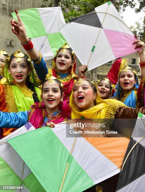 Girls in traditional attire during a celebration ahead of Lohri festival, on January 11, 2020 in Amritsar, India. Lohri is a popular winter Punjabi...