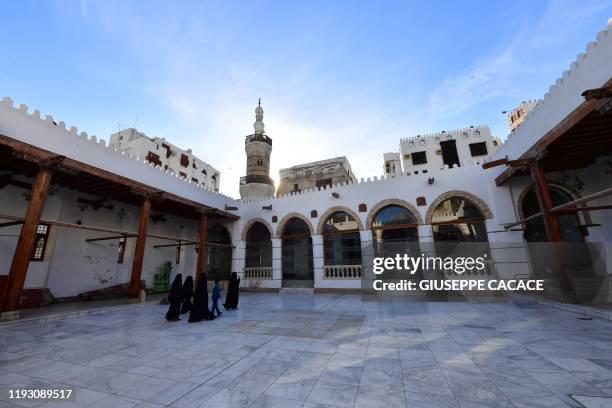 People walk inside the Shafei Historical mosque in Al-Balad, a historical area in the Saudi Arabian port city of Jeddah, on January 11, 2020.