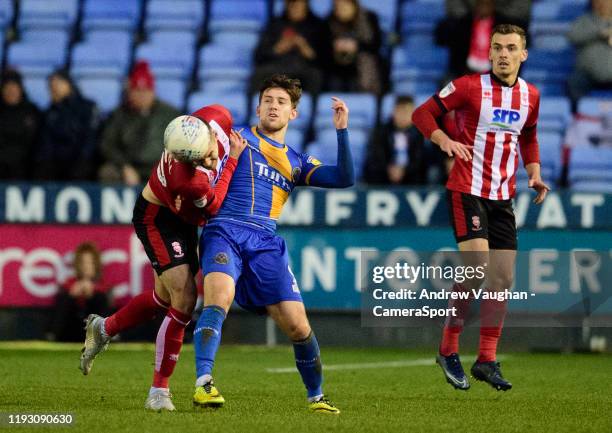 Lincoln City's Jason Shackell battles with Shrewsbury Town's Callum Lang during the Sky Bet League One match between Shrewsbury Town and Lincoln City...