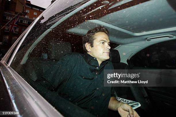 Lachlan Murdoch leaves his father Rupert's apartment on July 18, 2011 in London, England. The phone hacking scandal surrounding News International...