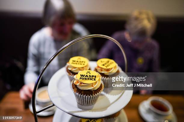 Some cupcakes with the words 'WASPI Women' are displayed as Nicola Sturgeon and SNP general election candidate Mhairi Black campaign at Bianco E Nero...