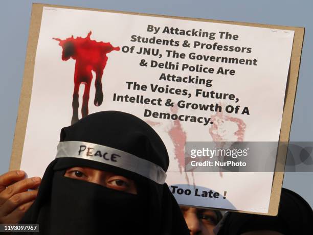 Demonstrator wearing a headband attends a protest against recent violence at the Jawaharlal Nehru University in Mumbai, India on 11 January 2020....