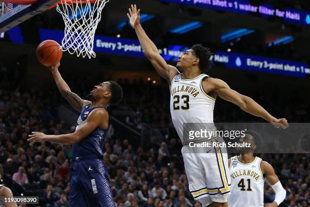 Terrell Allen of the Georgetown Hoyas attempts a layup as Jermaine Samuels and Saddiq Bey of the Villanova Wildcats defend during the first half of a...