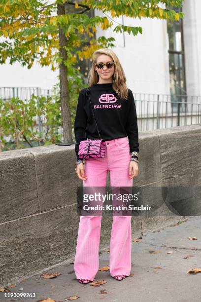 Fashion Content Editor for Bergdorf Goodman Jessica Minkoff wears Celine shoes, Marc Jacobs trousers, Balenciaga jumper, Saint Laurent bag and Chimi...