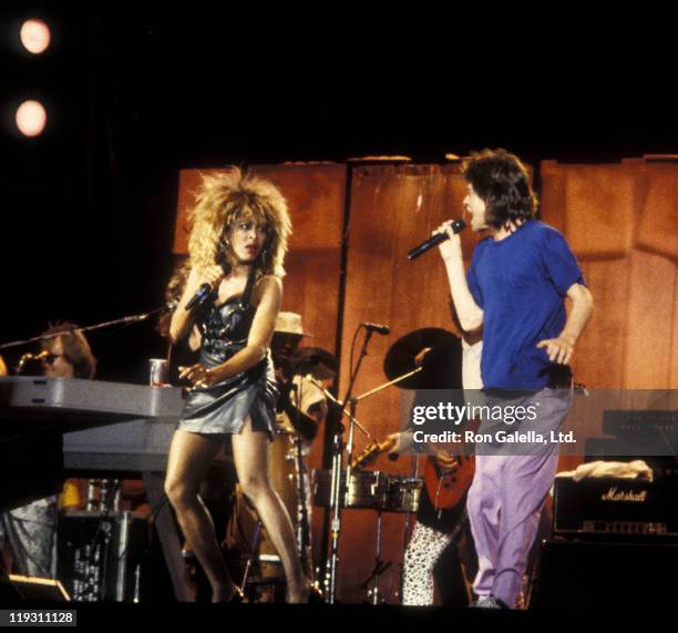 Musicians Tina Turner and Mick Jagger attend Live Aid Benefit Concert on July 13, 1985 at JFK Stadium in Philadelphia, Pennsylvania.