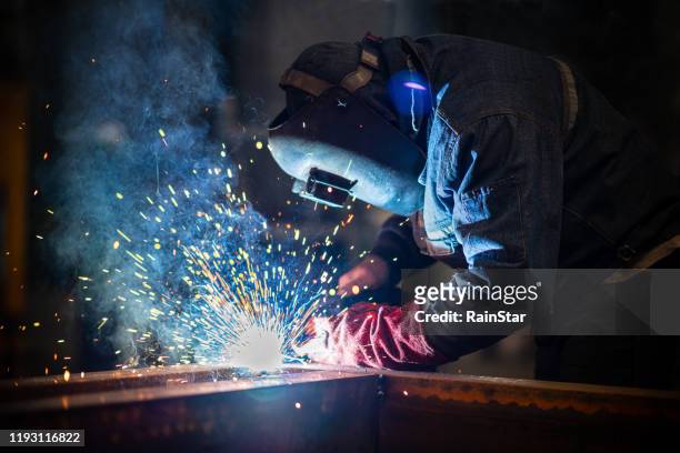 industrial welder with torch - blacksmith sparks stock pictures, royalty-free photos & images