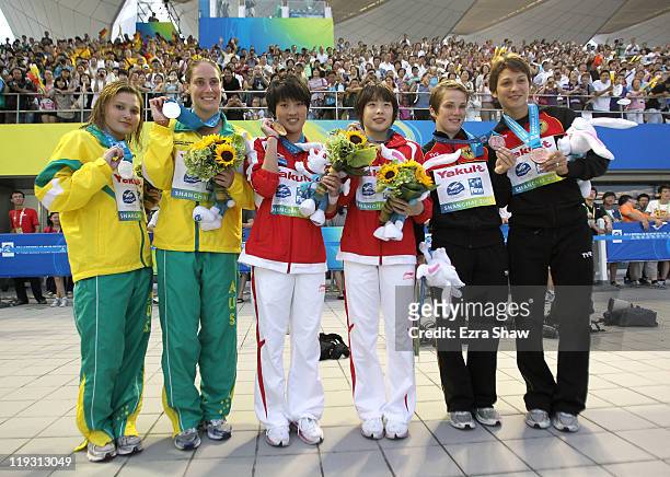 Gold medalists Wang Hao and Chen Ruolin of the People's Republic of China celebrate with silver medalists Melissa Wu and Alexandra Croak of Australia...