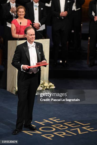 Professor William G. Kaelin Jr, laureate of the Nobel Prize in Medicine acknowledges applause after he received his Nobel Prize from King Carl XVI...