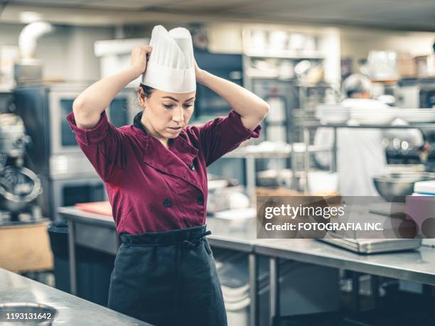 female chef taking a break - kitchen straighten stock pictures, royalty-free photos & images