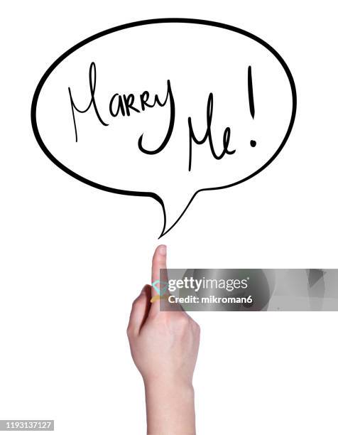 finger pointing on a speech bubble with marry me! - show me a picture of the human body fotografías e imágenes de stock