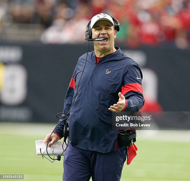 Head coach Bill O'Brien of the Houston Texans questions a penalty call by the officials during the second half against the Denver Broncos at NRG...