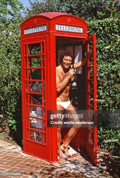 Singer Tom Jones poses for portrait at home in UK phone box, in July 1980 in Beverly Hills, California.