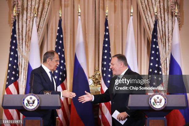 Russian Foreign Minister Sergey Lavrov and U.S. Secretary of State Mike Pompeo shake hands at the conclusion of a joint news conference in the...