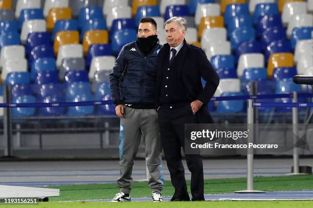 Carlo Ancelotti SSC Napoli coach and his assistant Davide Ancelotti during the UEFA Champions League group E match between SSC Napoli and KRC Genk at...