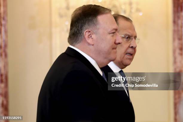 Secretary of State Mike Pompeo and Russian Foreign Minister Sergey Lavrov arrive for a joint news conference in the Franklin Room at the State...