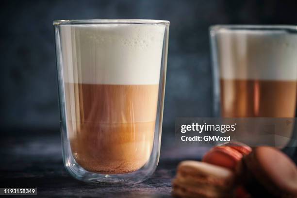 latte macchiato served with macarons - latte stock pictures, royalty-free photos & images