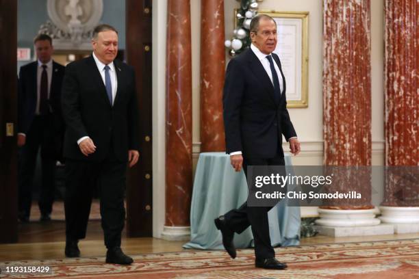 Secretary of State Mike Pompeo and Russian Foreign Minister Sergey Lavrov arrive for a joint news conference in the Franklin Room at the State...