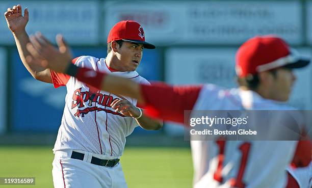 Lowell Spinners first baseman Boss Moanaroa and his teammates get loose in the outfield before a game at LeLacheur Park.