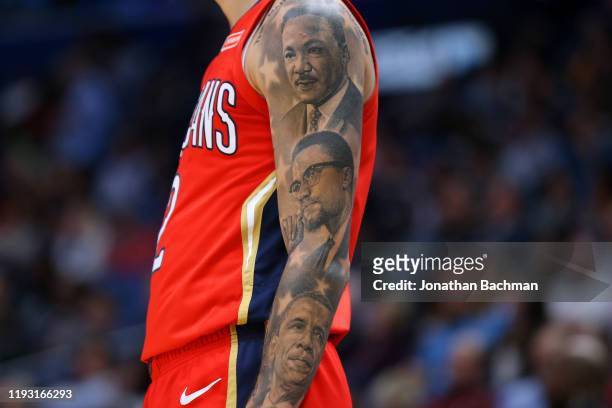 Lonzo Ball of the New Orleans Pelicans tattoos are pictured against the Detroit Pistons during the first half at the Smoothie King Center on December...