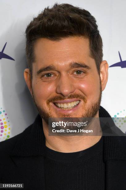 Michael Buble is presented with the 21 Club Award at The O2 Arena on December 10, 2019 in London, England. The award celebrates celebrating his 21st...