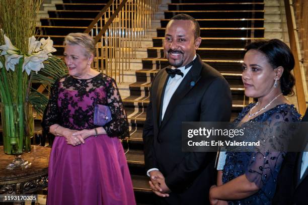 Berit Reiss-Andersen, Abiy Ahmed and Zinash Tayachew arrive at the Nobel Peace prize banquet dinner honoring the Nobel Laureates at Grand Hotel on...