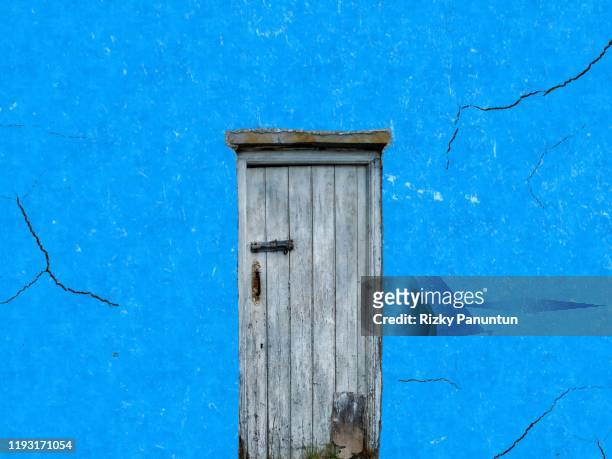 old door on abstract blue background texture concrete - abandoned crack house stock pictures, royalty-free photos & images