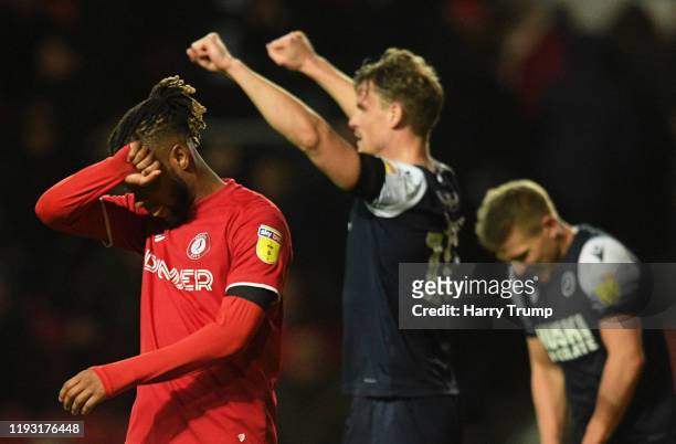 Kasey Palmer of Bristol City reacts at the final whistle as Matt Smith of Millwall celebrate during the Sky Bet Championship match between Bristol...