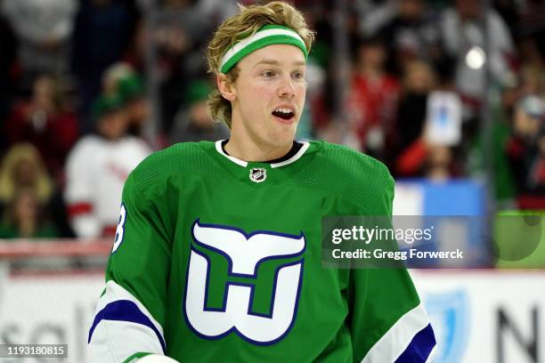 Ryan Dzingel of the Carolina Hurricanes warms up during pregame on Whalers' night prior to an NHL game against the Los Angeles Kings on January 11,...