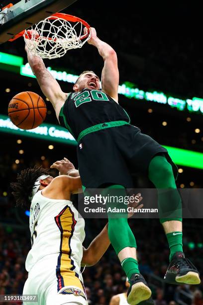 Gordon Hayward of the Boston Celtics dunks the ball over Jahlil Okafor of the New Orleans Pelicans at TD Garden on January 11, 2019 in Boston,...