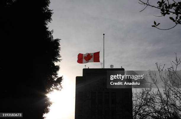 The Canadian flag flies at half mast for the victims of a plane crash in Iran, above the Vancouver City Hall, B.C., Canada on January 11, 2020.