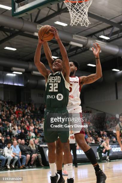 Jemerrio Jones of the Wisconsin Herd shoots against Marques Bolden of the Canton Charge during an NBA G-League game on January 11, 2020 at Menominee...