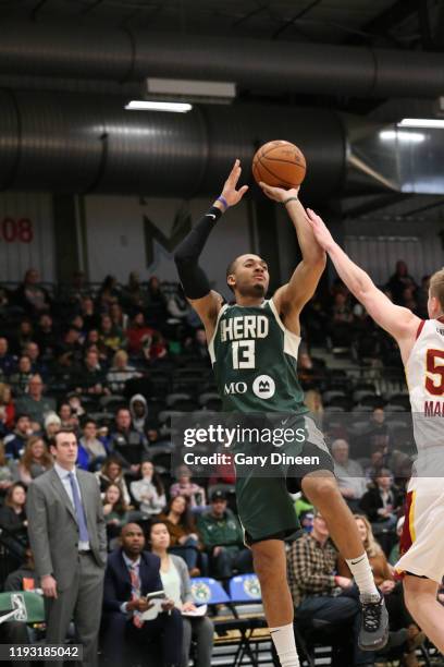 Cameron Reynolds of the Wisconsin Herd shoots against the Canton Charge during an NBA G-League game on January 11, 2020 at Menominee Nation Arena in...