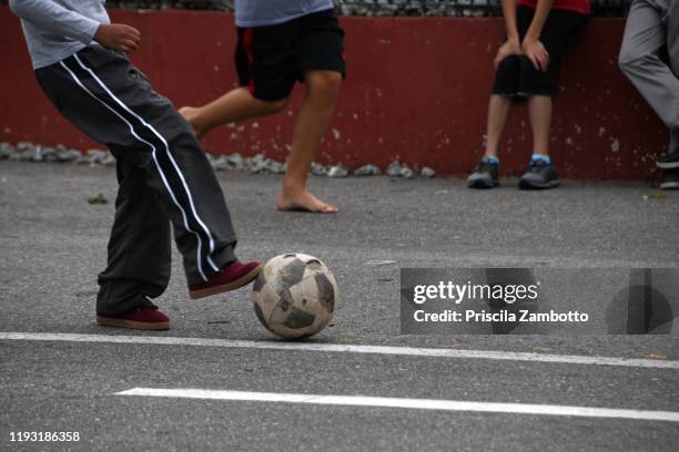 kids playing with ball - soccer - street football stock pictures, royalty-free photos & images