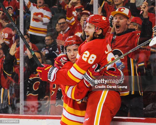 Elias Lindholm of the Calgary Flames celebrates after scoring the game-winning goal against the Edmonton Oilers during an NHL game at Scotiabank...