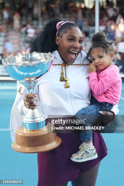 Serena Williams of the US with her daughter Alexis Olympia after her win against Jessica Pegula of the US during their women's singles final match...