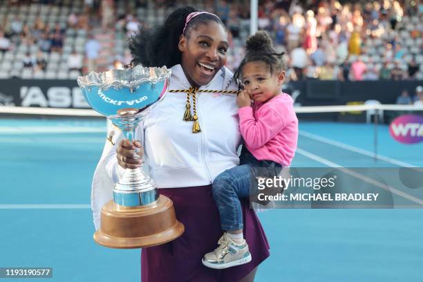Serena Williams of the US with her daughter Alexis Olympia after her win against Jessica Pegula of the US during their women's singles final match...