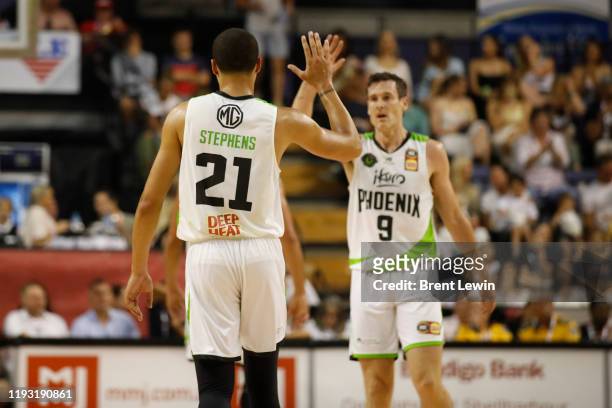Kendall Stephens, left, Ben Madgen of the Phoenix high five during the round 15 NBL match between the Illawarra Hawks and the South East Melbourne...