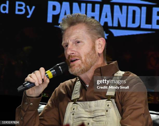 Singer/songwriter Rory Feek speaks onstage during the "Outside the Barrel" with Flint Rasmussen show during the National Finals Rodeo's Cowboy...