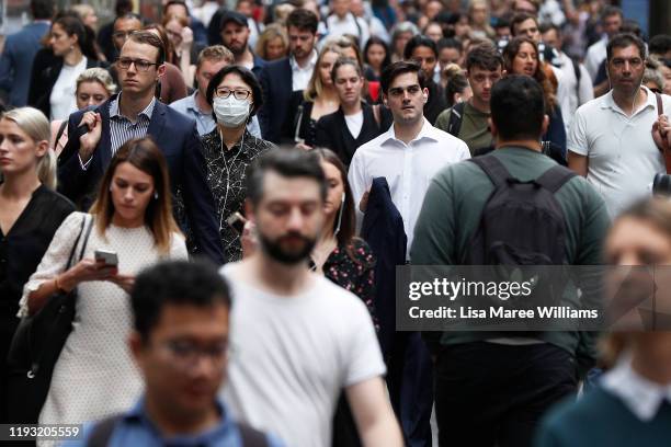 Man wears a face mask as smoke haze is seen over Sydney and the air quality index reaches higher than ten times hazardous levels in some suburbs on...