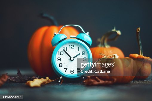 Time for Fall. Teal alarm clock with leaves and Pumpkins Time for Fall. Teal alarm clock with leaves and Pumpkins