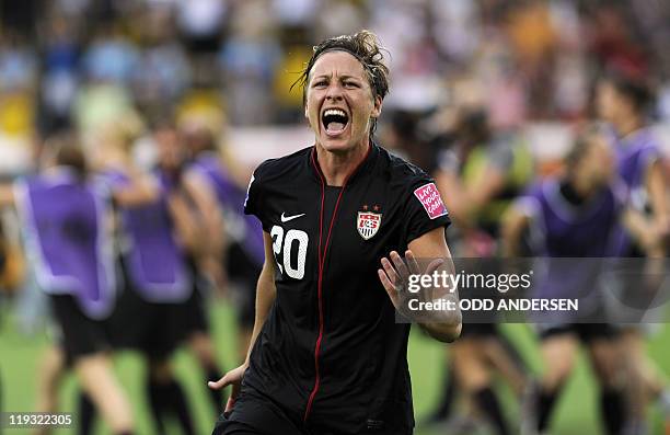 S striker Abby Wambach celebrates after scoring the 2-2 during the quarter-final match of the FIFA women's football World Cup Brazil vs USA on July...