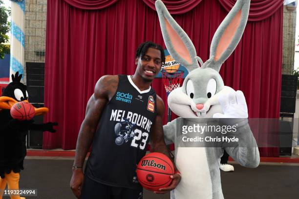 Casey Prather of Melbourne United poses with Bugs Bunny during the NBL Looney Tunes Jersey Launch at Movie World on December 11, 2019 in Gold Coast,...