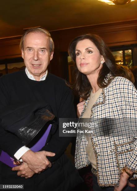 Auctioneer Simon de Pury and Caroline Barclay attend the Sophie Wiesenfeld Party at Cafe de Flore on December 10, 2019 in Paris, France.