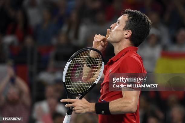 Roberto Bautista Agut of Spain reacts after winning against Dusan Lajovic of Serbia in their men's singles match in the final of the ATP Cup tennis...