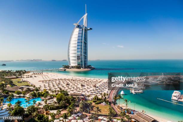 daytime shot of burj al arab hotel - dubai buildings stock pictures, royalty-free photos & images