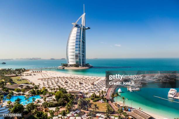 daytime shot of burj al arab hotel - burj al arab beach stock pictures, royalty-free photos & images